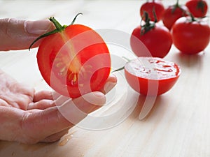 Delicious juicy red tomatoes. Tomato cut in half.