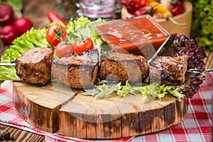 Delicious juicy skewered meat or shish kebabs on skewers of pork tenderloin