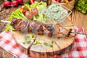 Delicious juicy skewered meat or shish kebabs on skewers of pork tenderloin