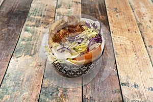 delicious kebab sandwich with iceberg lettuce, red cabbage, tomato slices,