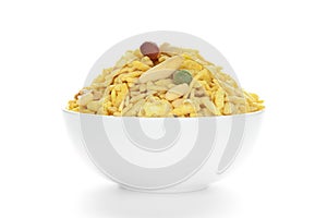 Delicious Khatta Meetha in a white Ceramic bowl, made with peanuts, sugar, raisins,