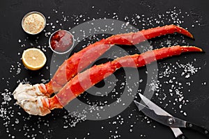 Delicious king crab legs with eating tools top view