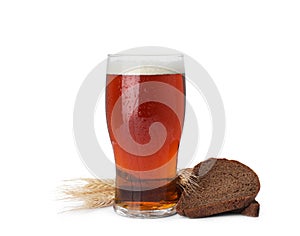 Delicious kvass, bread and spikes on background