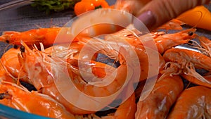 Delicious large unpeeled shrimp in a glass bowl