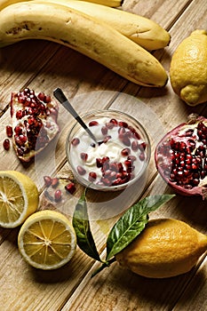 Delicious lemon and pomegranate dessert in the glass bowl