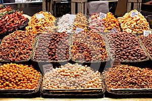 Delicious looking display of a variety of chocolate, nuts and dried fruit sweet treats