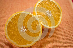 Delicious looking juicy halves of oranges on the table