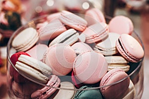 delicious macaroons close-up. candy bar at luxury wedding reception. exclusive expensive catering. table with modern desserts. sp