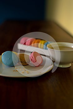 Delicious macaroons on the wooden table, with copy space