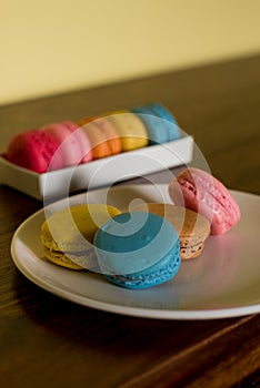 Delicious macaroons on the wooden table, with copy space