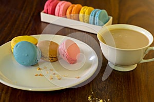 Delicious macaroons on the wooden table, with copy space