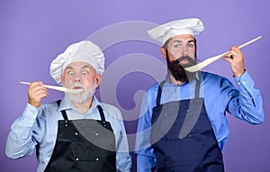 So delicious. mature senior bearded men in kitchen. new recipe. Perfect taste. Chef men cooking. cheerful men prepare