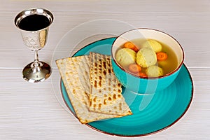 Delicious Matzoh ball soup with Pesach Passover symbols