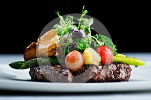 A delicious meal - Ribeye Steak Black Angus with asparagus photo