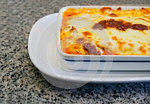 Delicious meat Lasagne in white ceremic plate