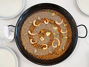 Delicious mediterranean rice with shrimps, scallop and mussels.