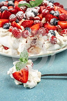 delicious meringue cake Pavlova with fresh straberry, vertical image. top view. place for text