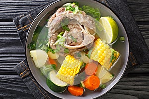 Delicious Mexican beef soup with vegetables close-up in a bowl. horizontal top view