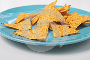 Delicious Mexican Nachos Corn Chips on a Blue Plate