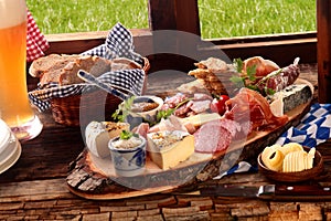 Delicious midday meal of a meat and cheese platter photo