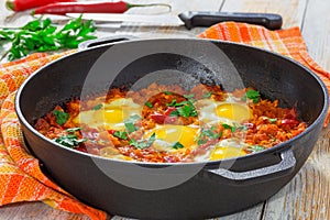 Delicious middle east shakshuka - fried eggs, onion, bell peppe