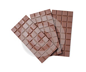 Delicious milk chocolate bars isolated on white, top view