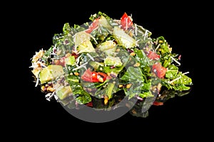 Delicious mixed salad with seeds, spinach, cheese and dressing with reflection