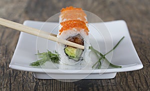 Delicious mixed sushi arranged on white marble surface