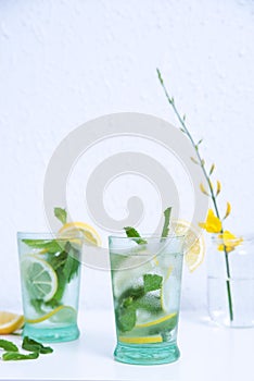 Delicious mojitos, with ice, lemon and mint.