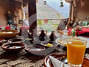 Delicious Moroccan breakfast on beautiful rooftop terrace in the High Atlas Mountains. Imlil, Morocco.