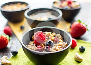 delicious muesli with fresh and dried fruit in a small bowl.