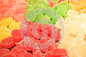 Delicious multi-colored fruit marmalade. unhealthy bright candies in bulk. different jelly photo close. tasty sweets in the candy