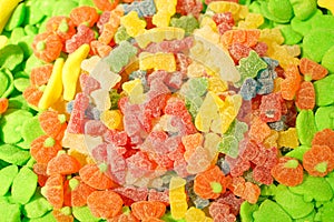 Delicious multi-colored fruit marmalade. unhealthy bright candies in bulk. different jelly photo close. tasty sweets in the candy