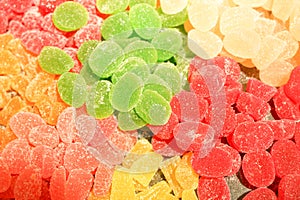 Delicious multi-colored fruit marmalade. unhealthy bright candies in bulk. different jelly photo close. tasty sweets in the candy