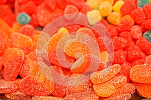 Delicious multi-colored fruit marmalade. unhealthy bright candies in bulk. different jelly photo close. tasty sweets in the candy