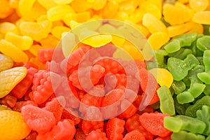 Delicious multi-colored fruit marmalade. unhealthy bright candies in bulk. different jelly photo close. tasty sweets in the candy