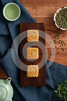 Delicious mung bean moon cake for Mid-Autumn Festival food mooncake on wooden table background