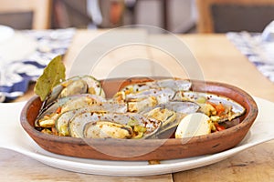 Delicious mussels casserole on wood