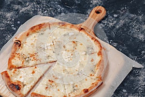 Delicious Neapolitan pizza with cheese. four kinds of cheese. concept of delicious italian pizza