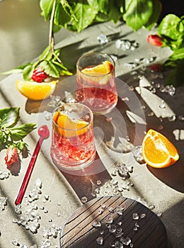 Delicious negroni cocktails with campari, gin, vermouth and slices of citrus orange and ice