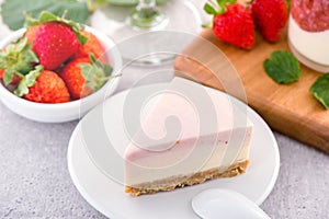 Delicious and nutritious handmade strawberry no bake frozen gradient colour fromage frais cheesecake slice with raw sarcocarp