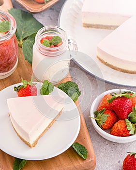 Delicious and nutritious handmade strawberry no bake frozen gradient colour fromage frais cheesecake slice with raw sarcocarp