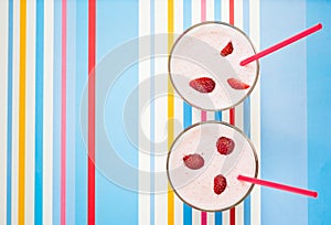 Delicious, nutritious and healthy fresh strawberry yogurt on bright background, top view