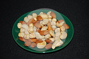 Delicious nuts on a saucer.