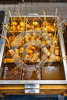 Delicious oden Japanese cuisine with meat balls stick in soup