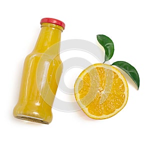 Delicious orange juice in a bottle and slice of orange next to it. Isolated on white. Top view