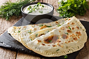 Delicious organic flat bread qutab stuffed with herbs served wit