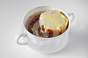 delicious original French onion soup on a white background