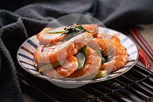 Delicious pan-fried shrimp on dark wooden table background