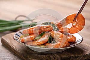 Delicious pan-fried shrimp on dark wooden table background